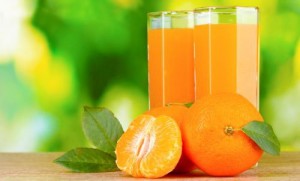 Healthy mandarin juice on wooden table